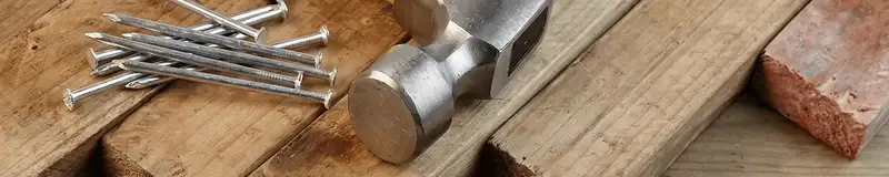 Hammer and nails on hardwood flooring boards in Pittsburgh, PA