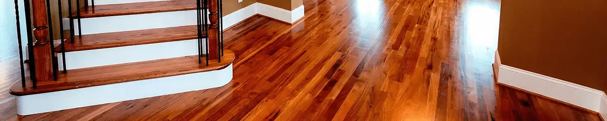 Base floor of a staircase with professionally restored wood flooring in Pittsburgh PA